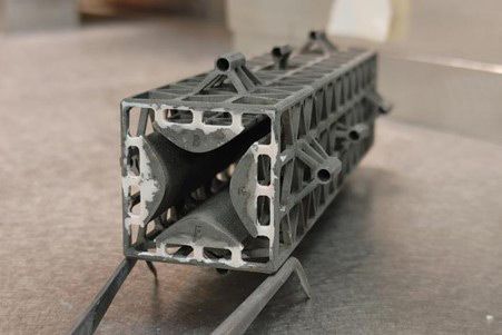 This photo shows an example of a 3D-printed miniaturized QMF.