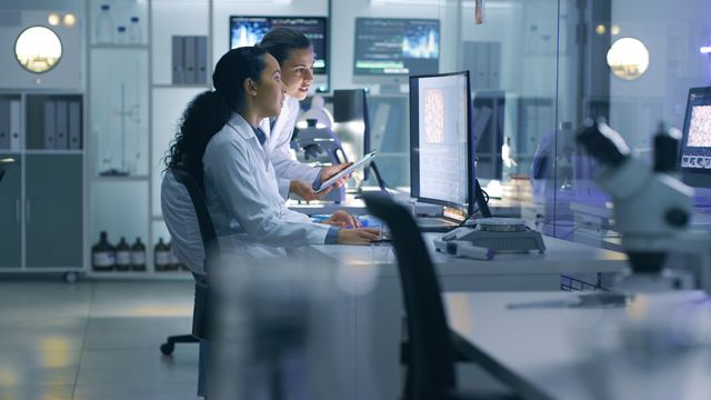 Lab scientists reviewing medical images 