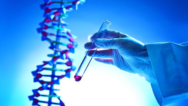 Double helix structure of DNA and a test tube. 