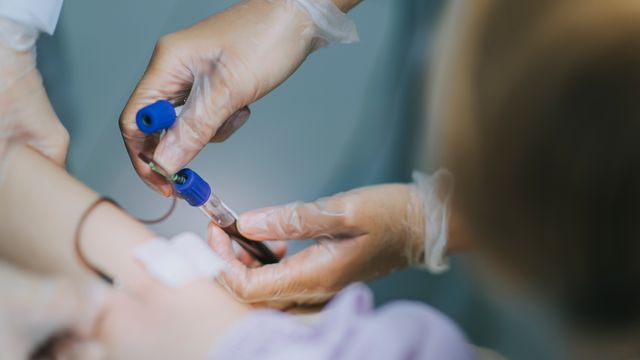 A medical professional taking a blood test. 